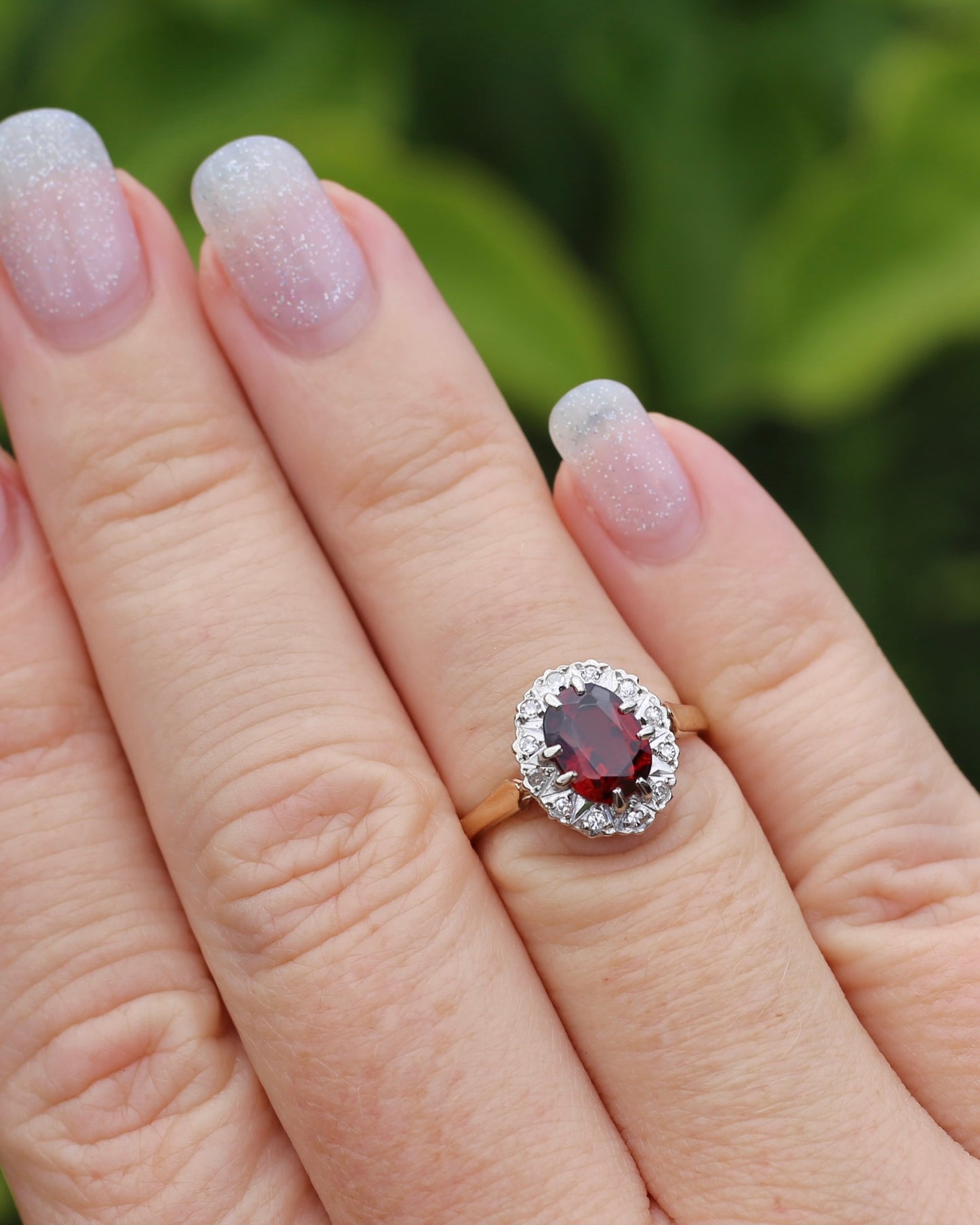 1974 Made Garnet and Diamond Halo Ring, 9ct Yellow and White Gold, size M1/2 or 6.5, 2.83g