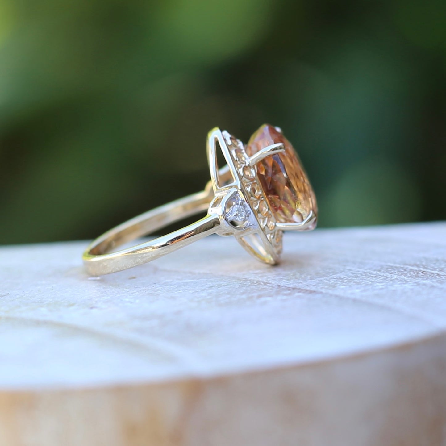 Oval Pale Orange Tourmaline Ring with Pierced Wire Surrounds and Diamonds in the Shoulders, 9ct Yellow Gold, size N or 6.75