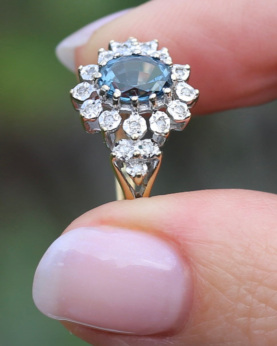 1989 Blue Zircon and Diamond Halo Ring, 9ct Yellow and White Gold, size N1/2 or 7, 3.18g