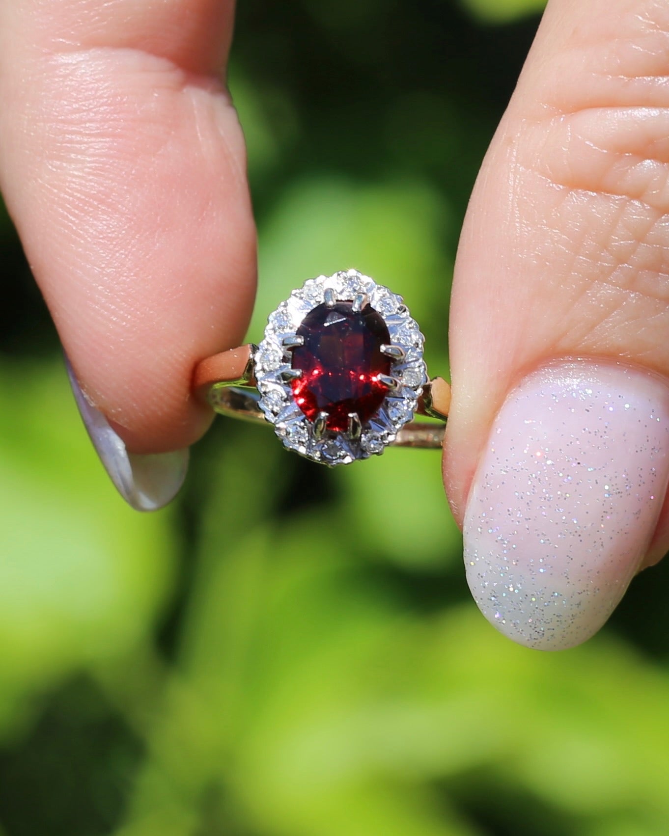 1974 Made Garnet and Diamond Halo Ring, 9ct Yellow and White Gold, size M1/2 or 6.5, 2.83g