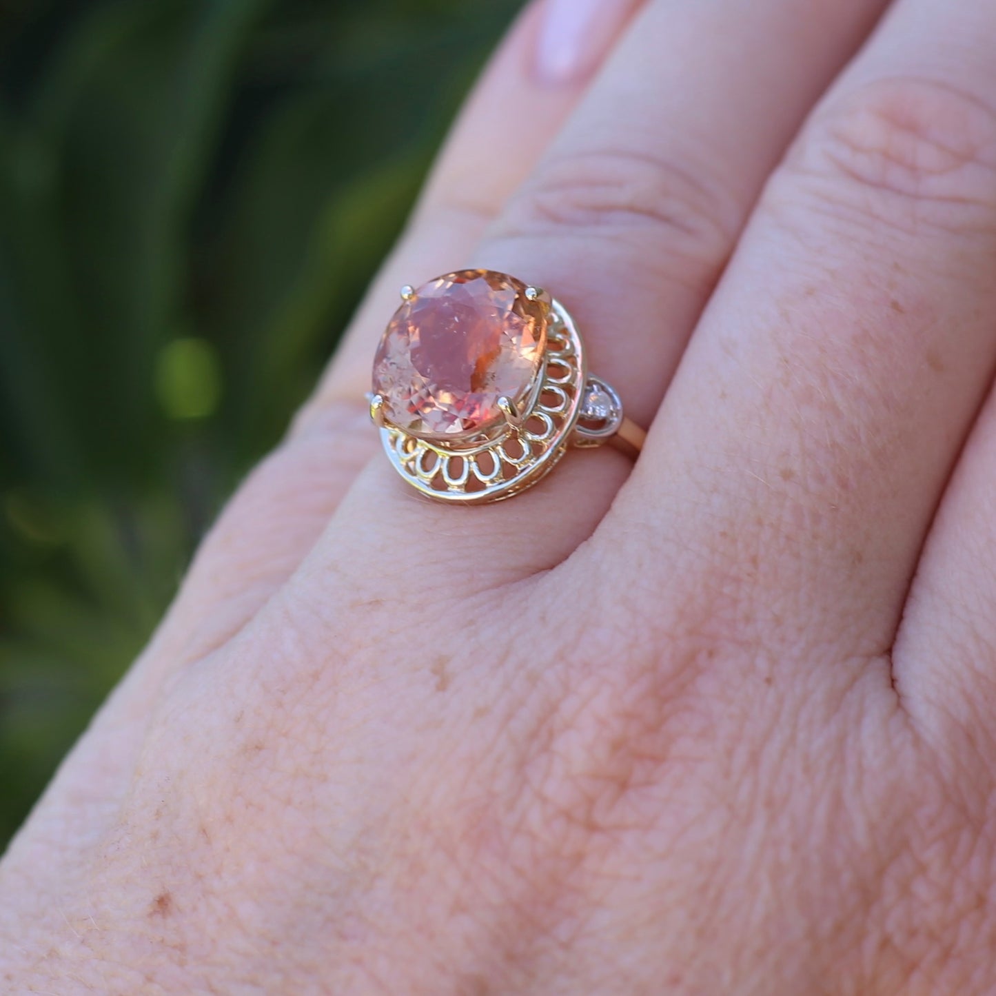 Oval Pale Orange Tourmaline Ring with Pierced Wire Surrounds and Diamonds in the Shoulders, 9ct Yellow Gold, size N or 6.75