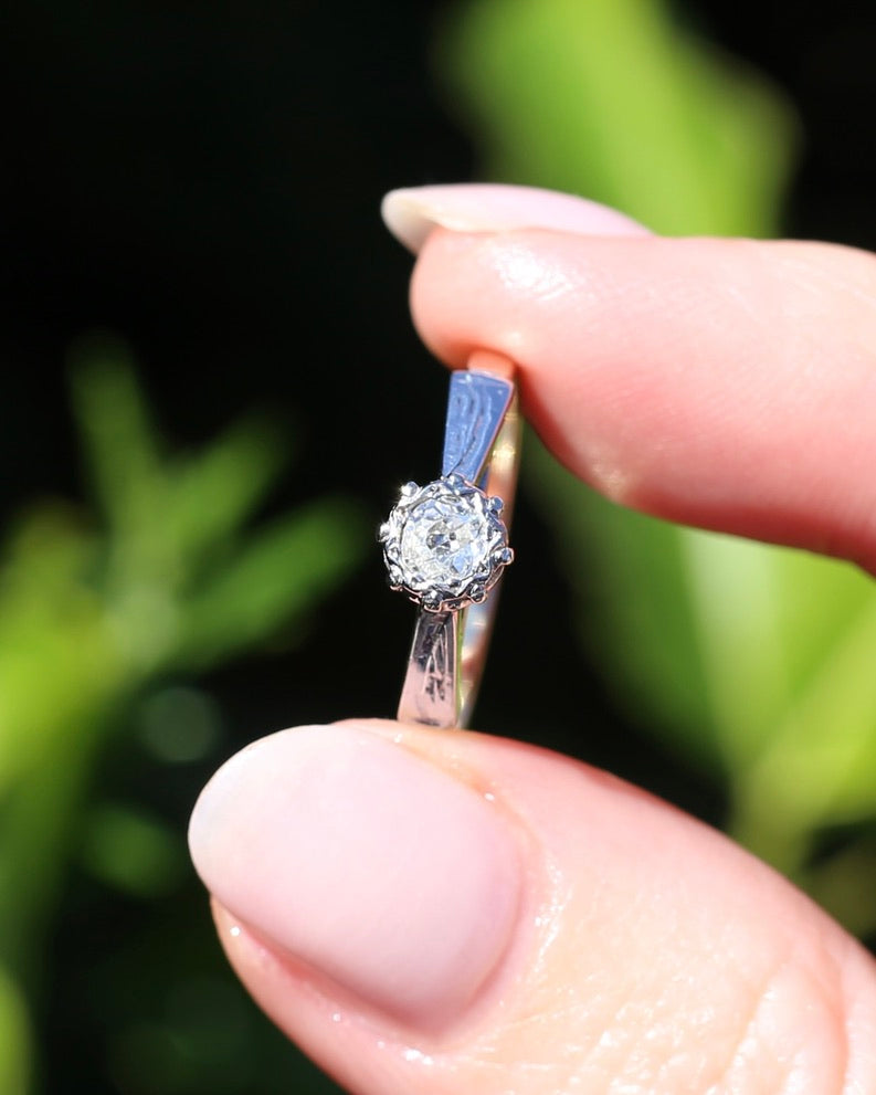 0.22ct old cut diamond solitaire, Platinum and Pale 18ct Gold, size P1/2
