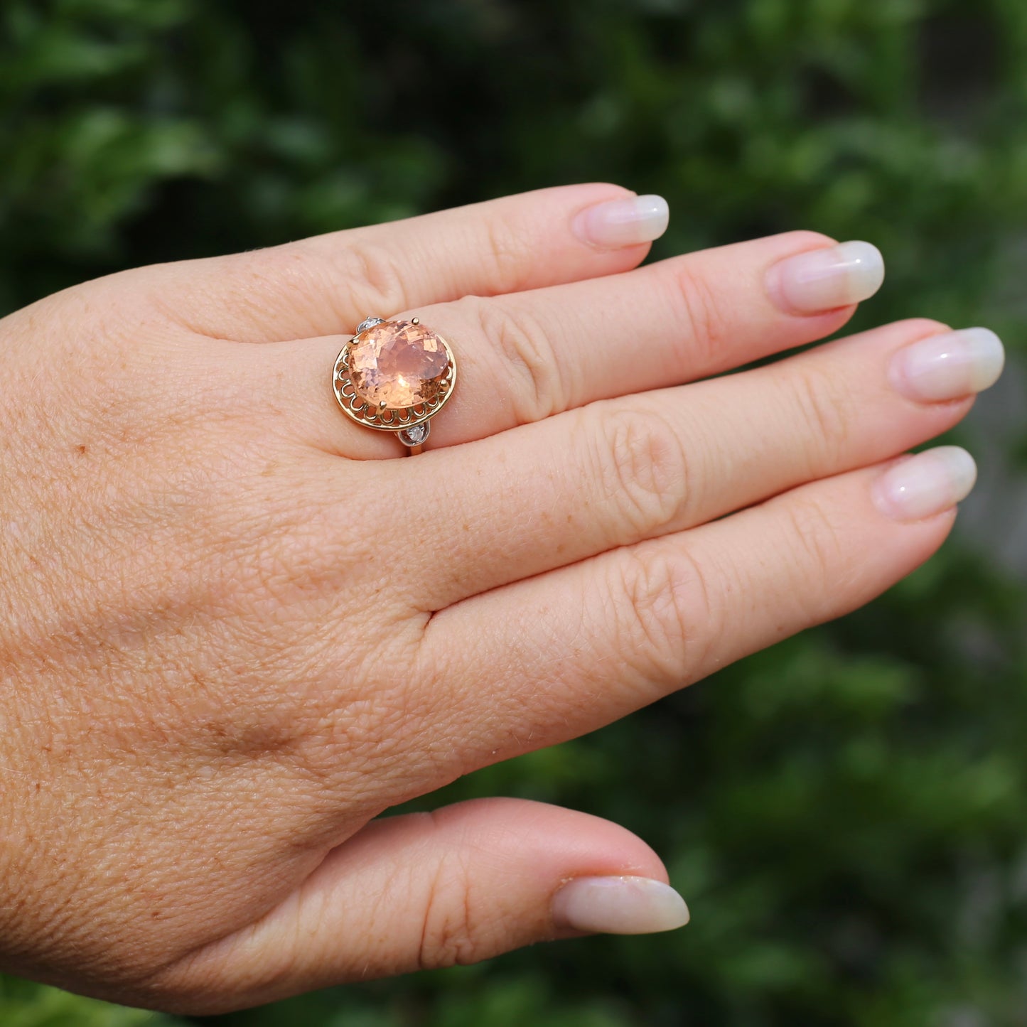 Oval Peach Tourmaline Ring with Pierced Wire Surrounds and Diamonds in the Shoulders, 9ct Yellow Gold, size N or 6.75