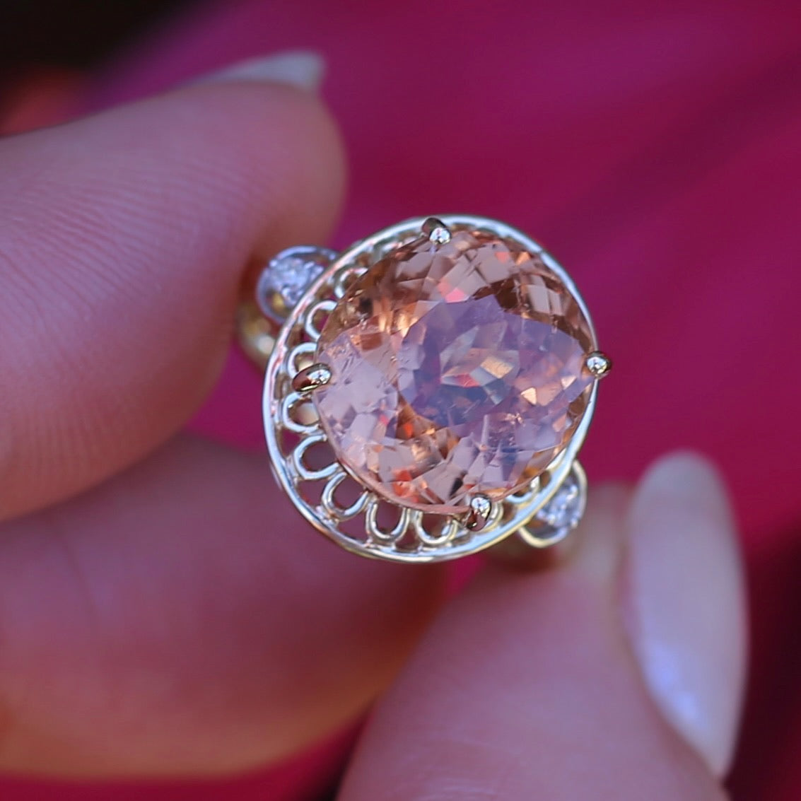 Oval Pale Orange Tourmaline Ring with Pierced Wire Surrounds and Diamonds in the Shoulders, 9ct Yellow Gold, size N or 6.75