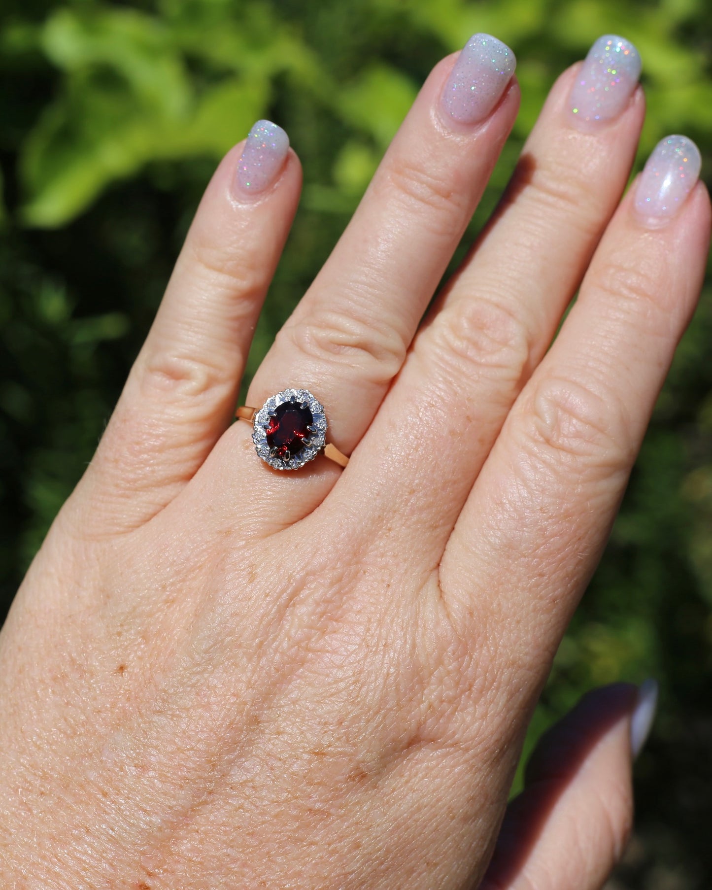 1974 Made Garnet and Diamond Halo Ring, 9ct Yellow and White Gold, size M1/2 or 6.5, 2.83g