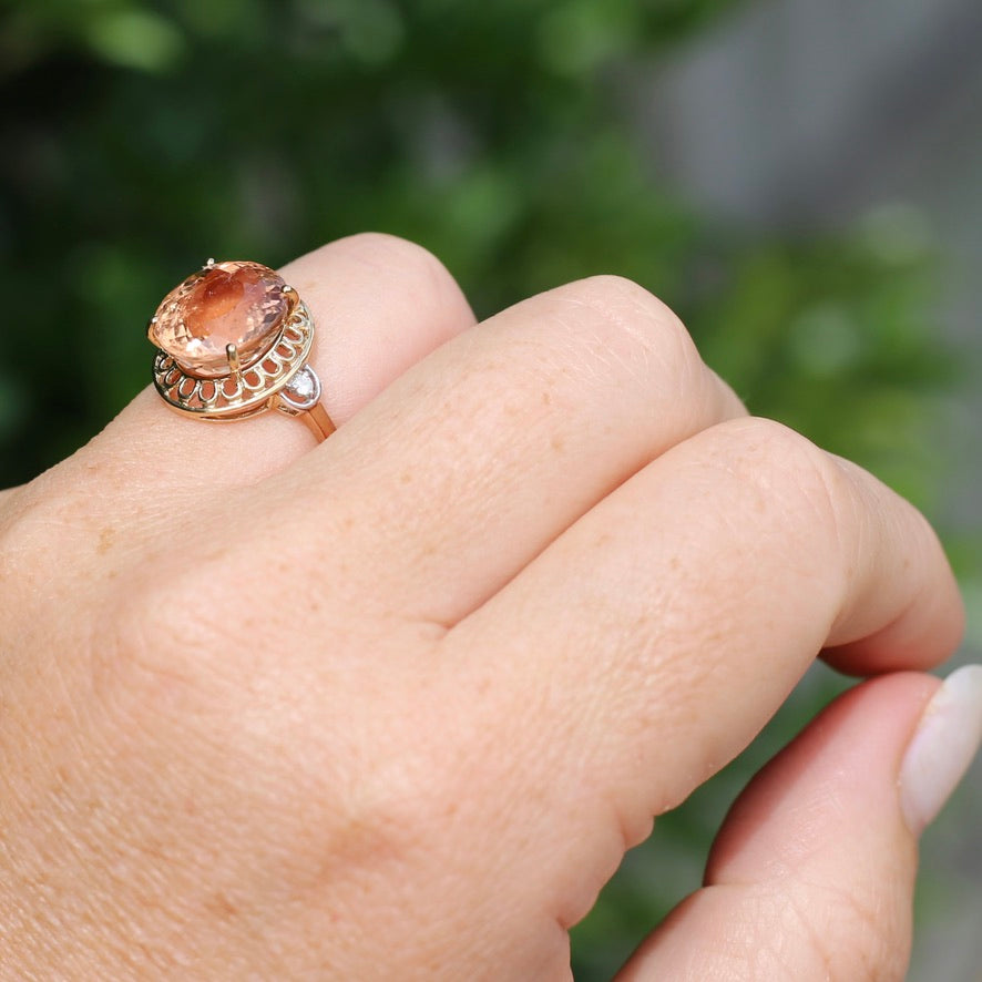 Oval Peach Tourmaline Ring with Pierced Wire Surrounds and Diamonds in the Shoulders, 9ct Yellow Gold, size N or 6.75