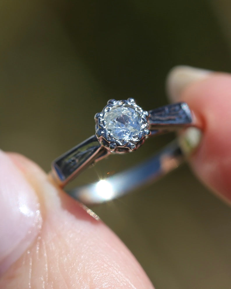 0.22ct old cut diamond solitaire, Platinum and Pale 18ct Gold, size P1/2