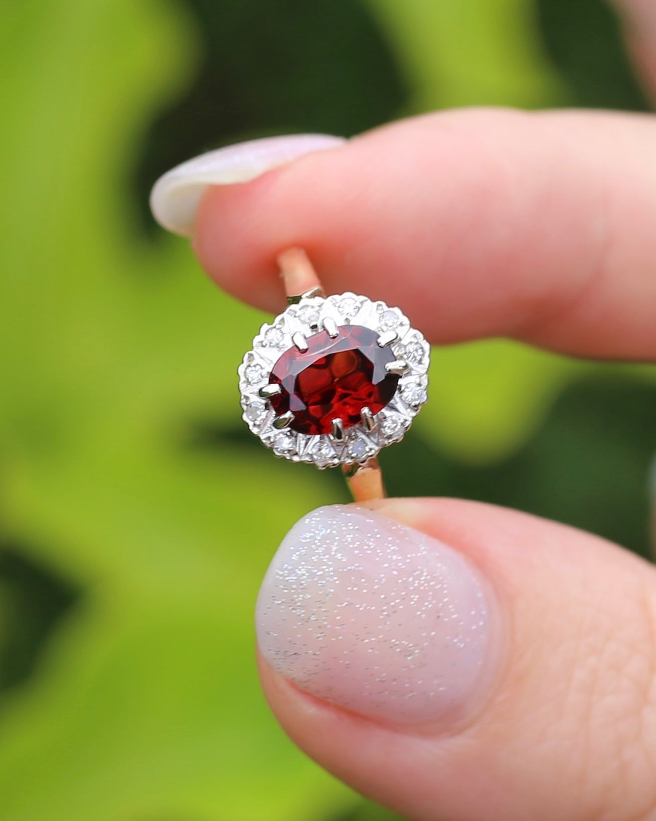 1974 Made Garnet and Diamond Halo Ring, 9ct Yellow and White Gold, size M1/2 or 6.5, 2.83g