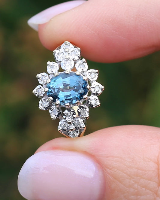1989 Blue Zircon and Diamond Halo Ring, 9ct Yellow and White Gold, size N1/2 or 7, 3.18g