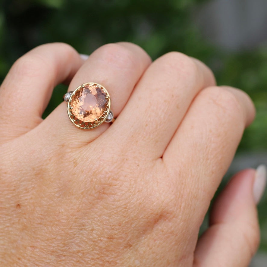 Oval Peach Tourmaline Ring with Pierced Wire Surrounds and Diamonds in the Shoulders, 9ct Yellow Gold, size N or 6.75