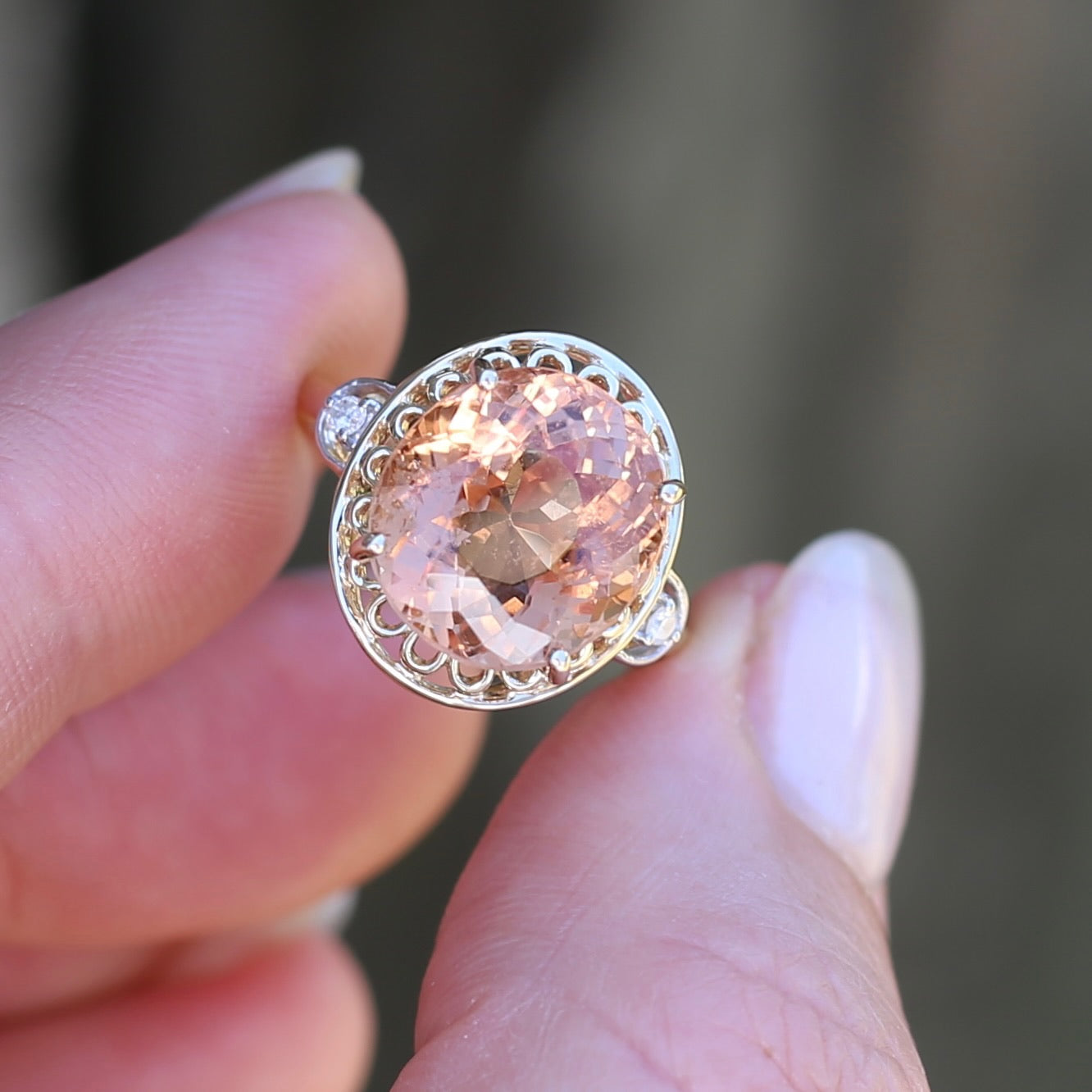 Oval Pale Orange Tourmaline Ring with Pierced Wire Surrounds and Diamonds in the Shoulders, 9ct Yellow Gold, size N or 6.75