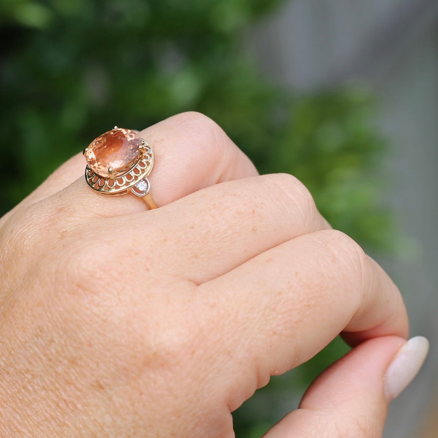 Oval Peach Tourmaline Ring with Pierced Wire Surrounds and Diamonds in the Shoulders, 9ct Yellow Gold, size N or 6.75