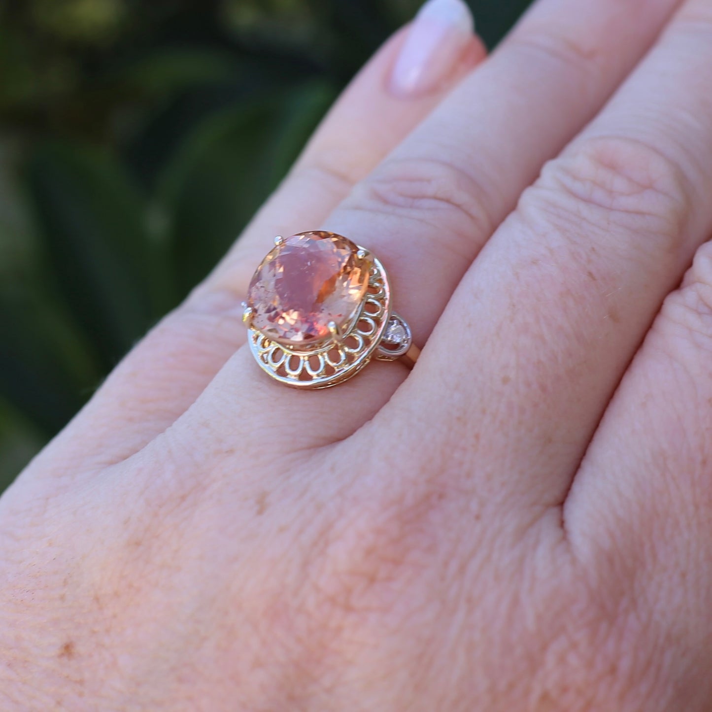 Oval Pale Orange Tourmaline Ring with Pierced Wire Surrounds and Diamonds in the Shoulders, 9ct Yellow Gold, size N or 6.75