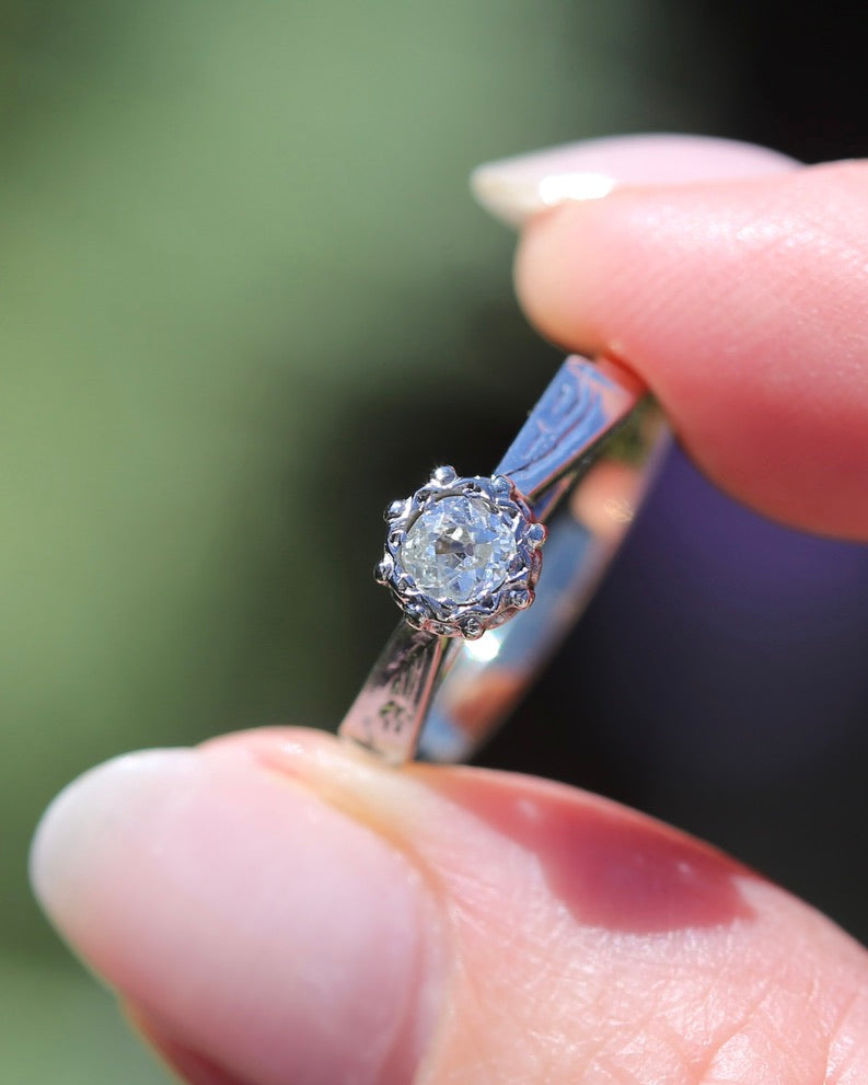 0.22ct old cut diamond solitaire, Platinum and Pale 18ct Gold, size P1/2