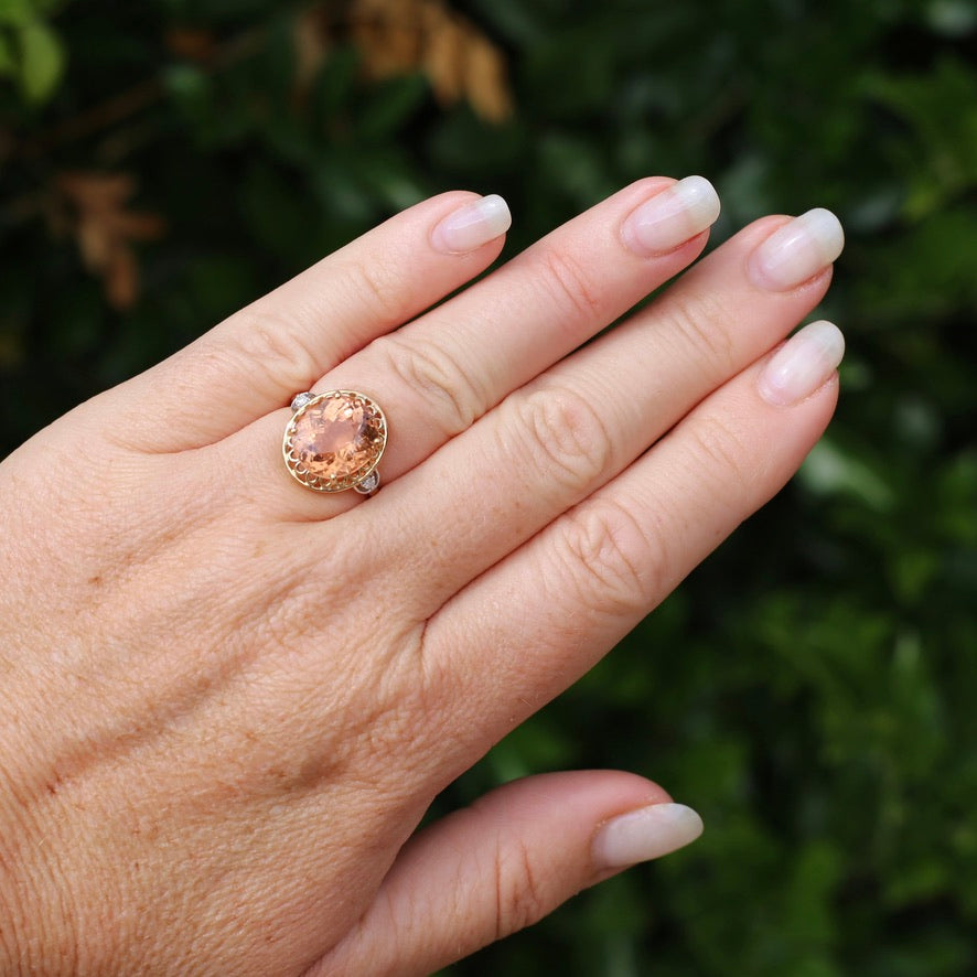 Oval Peach Tourmaline Ring with Pierced Wire Surrounds and Diamonds in the Shoulders, 9ct Yellow Gold, size N or 6.75