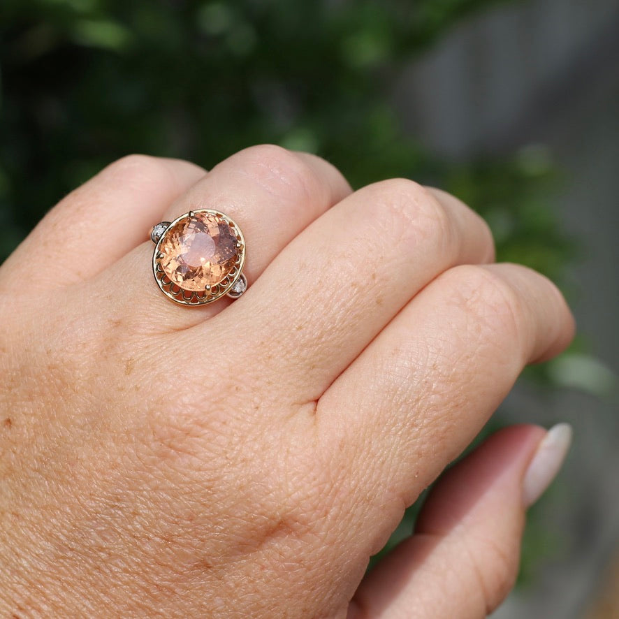 Oval Peach Tourmaline Ring with Pierced Wire Surrounds and Diamonds in the Shoulders, 9ct Yellow Gold, size N or 6.75