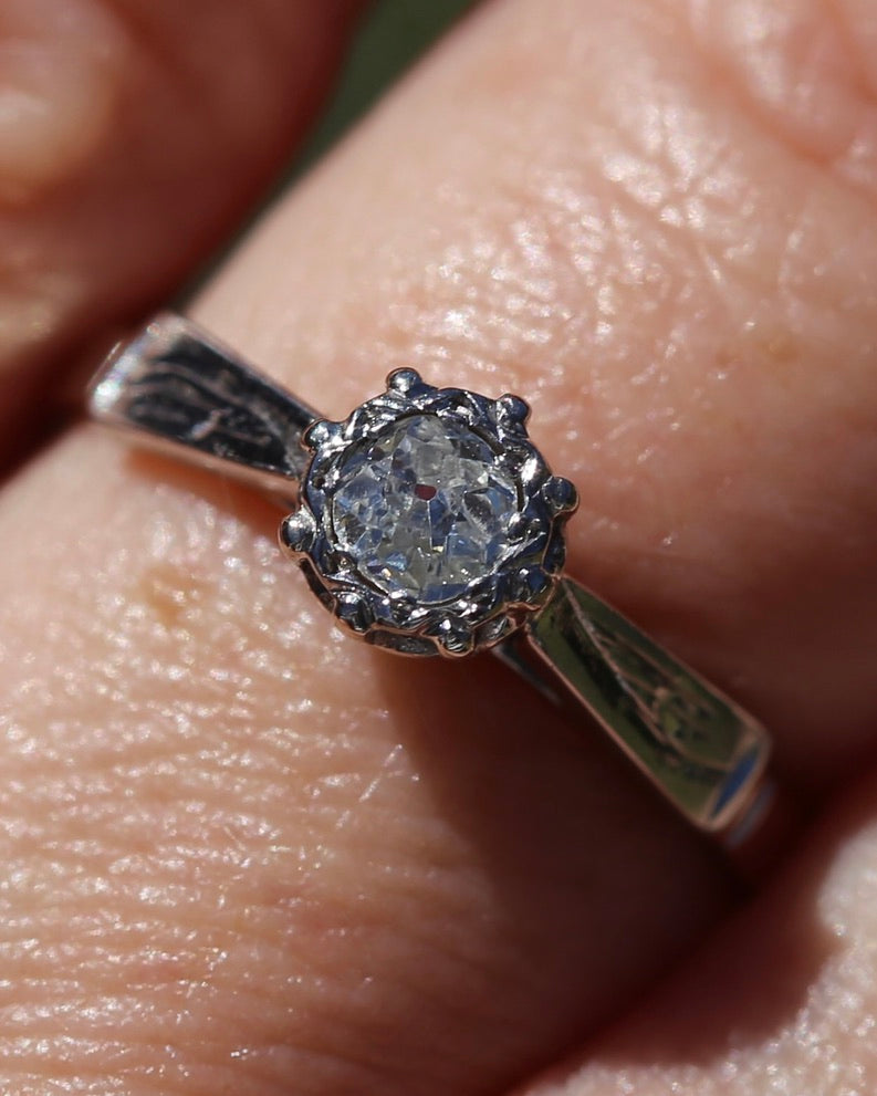 0.22ct old cut diamond solitaire, Platinum and Pale 18ct Gold, size P1/2