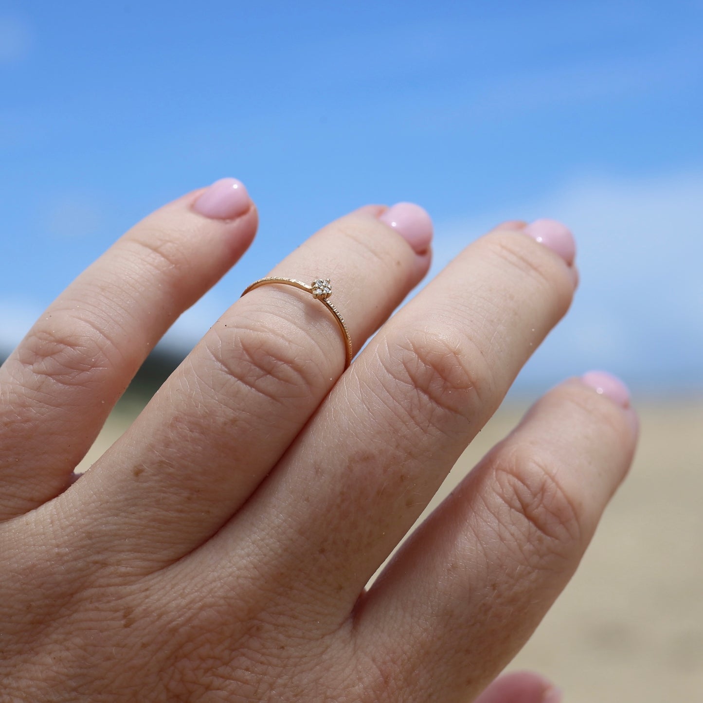 Dainty Textured Band with Four Round Brilliant Diamonds in a Diamond Shape, size M or just under 6.25