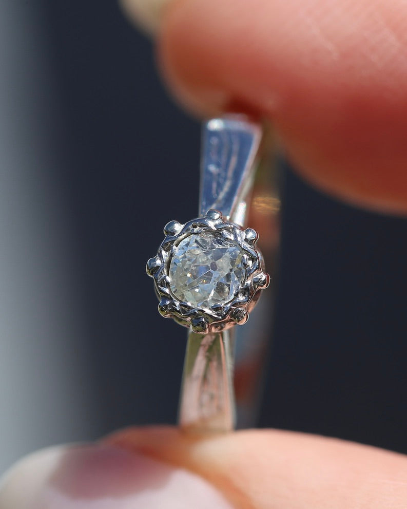 0.22ct old cut diamond solitaire, Platinum and Pale 18ct Gold, size P1/2