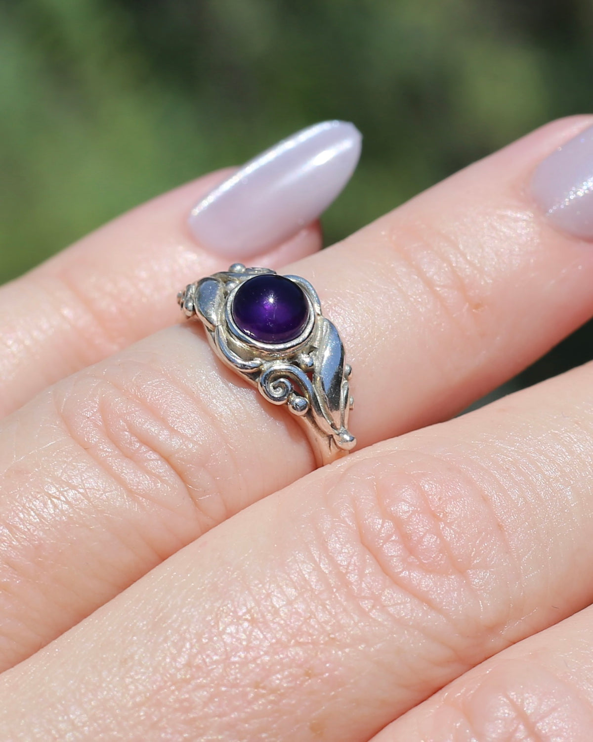 Amethyst Cabochon in Bezel Setting and Leaf & Swirl Surrounds, Sterling Silver, size J1/2 or 5, 3.38g