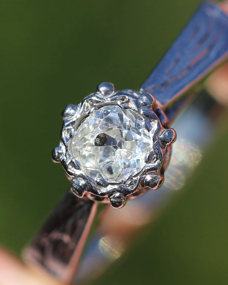 0.22ct old cut diamond solitaire, Platinum and Pale 18ct Gold, size P1/2