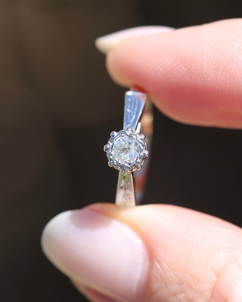 0.22ct old cut diamond solitaire, Platinum and Pale 18ct Gold, size P1/2