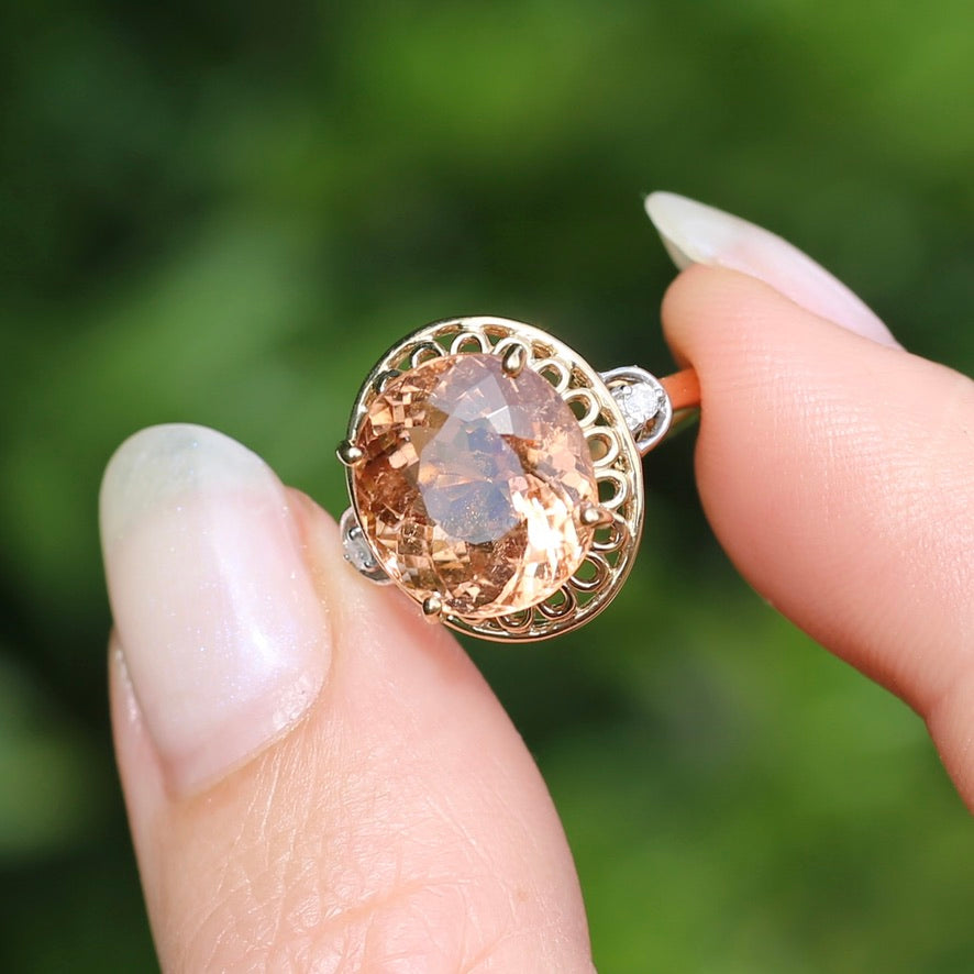 Oval Peach Tourmaline Ring with Pierced Wire Surrounds and Diamonds in the Shoulders, 9ct Yellow Gold, size N or 6.75